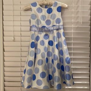 White dress with polka dots and sash